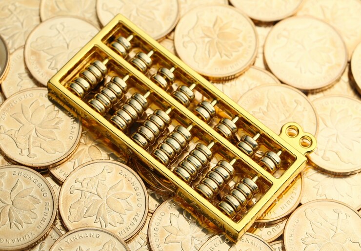 golden abacus with chinese rmb gold coins as background 1387 1